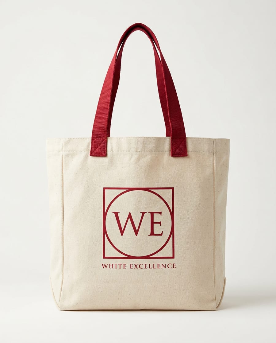 Natural canvas tote with red handles and a red WE monogram